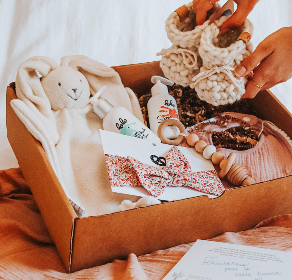 This surprise baby box contain several baby shower gift ideas